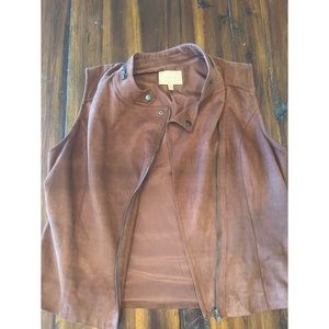 Skies are blue suede vest.